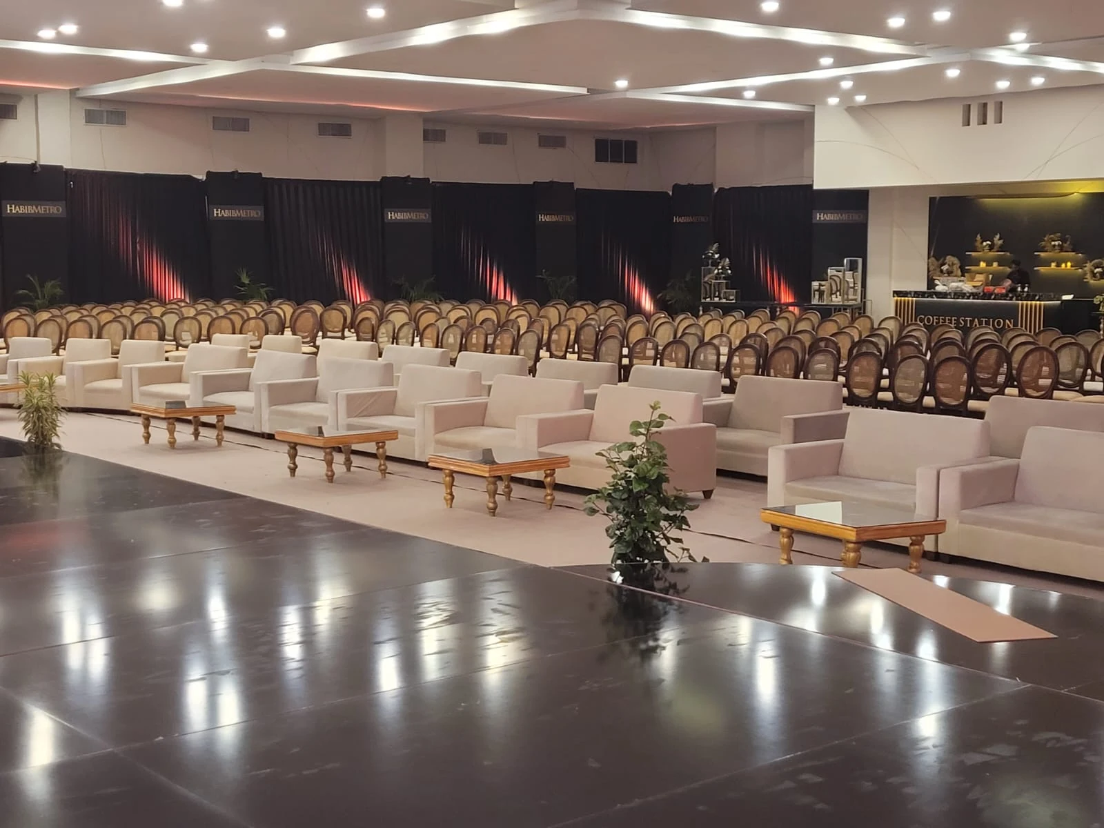 Lounge seating and event chairs arranged inside a banquet venue.
